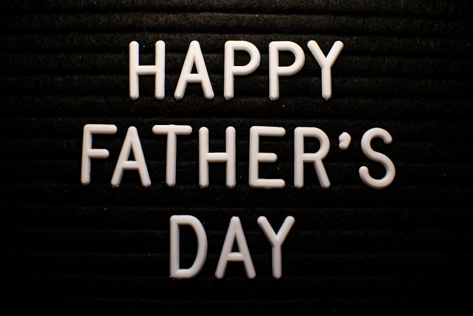 White letters on a black board spelling out Happy Father's Day, perfect for celebrations.