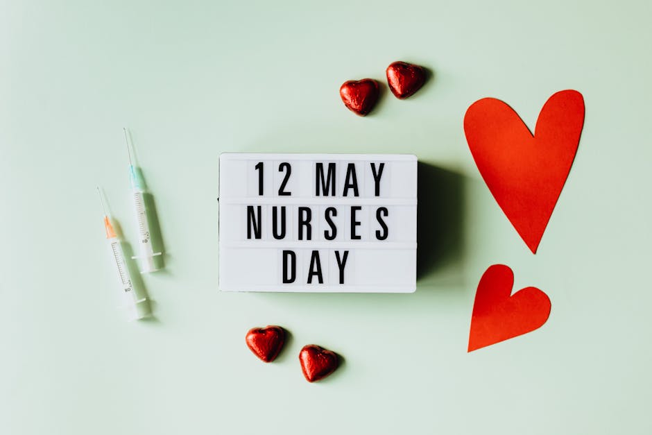 A lightbox displaying Nurses Day on May 12 with syringes and heart symbols symbolizing care and appreciation.