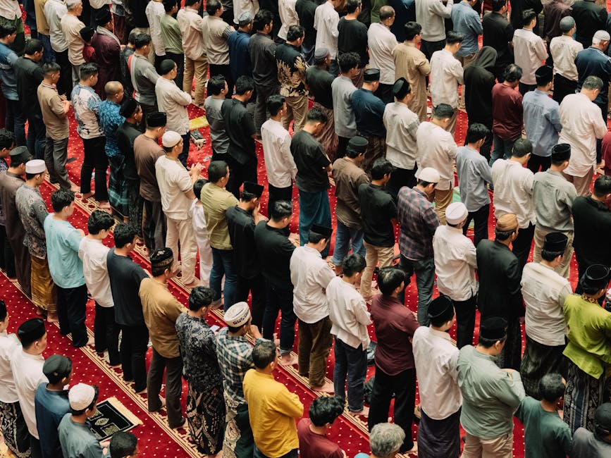 Muslims gathered inside a mosque for prayer, showing unity and devotion in Islamic practice.
