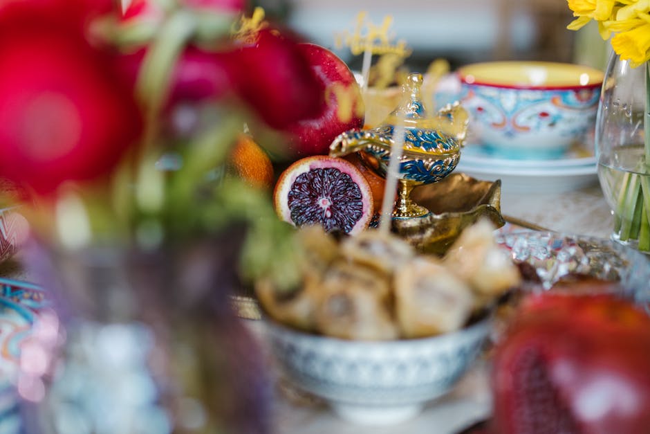Vibrant still life of a festive table with fruit and decorative items.