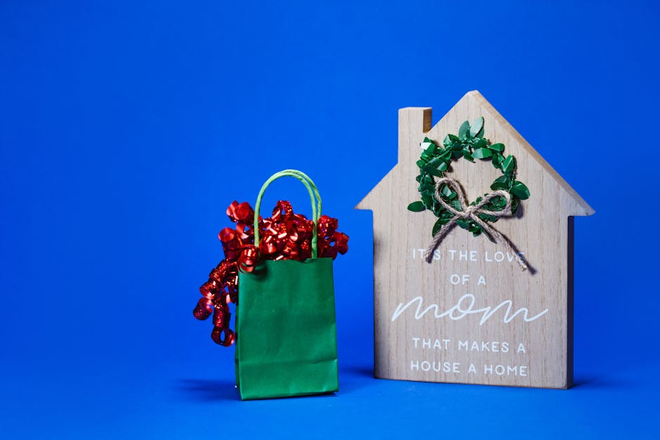 Green gift bag and wooden decor with a heartfelt quote for Mother's Day.