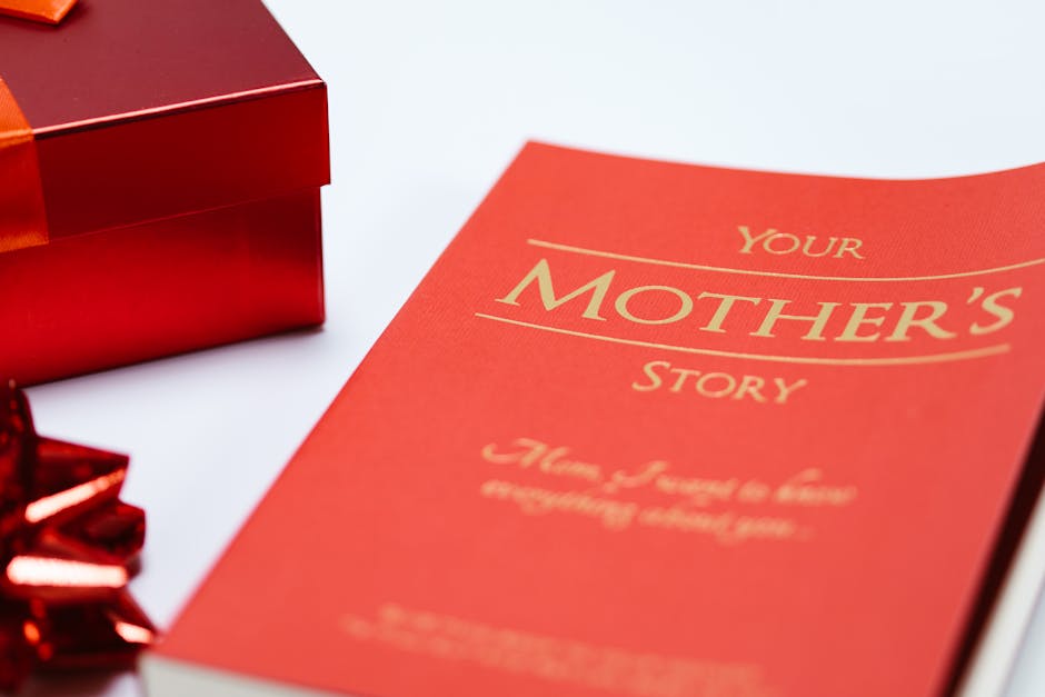 Close-up of a red book and gift box, perfect for Mother's Day celebrations.