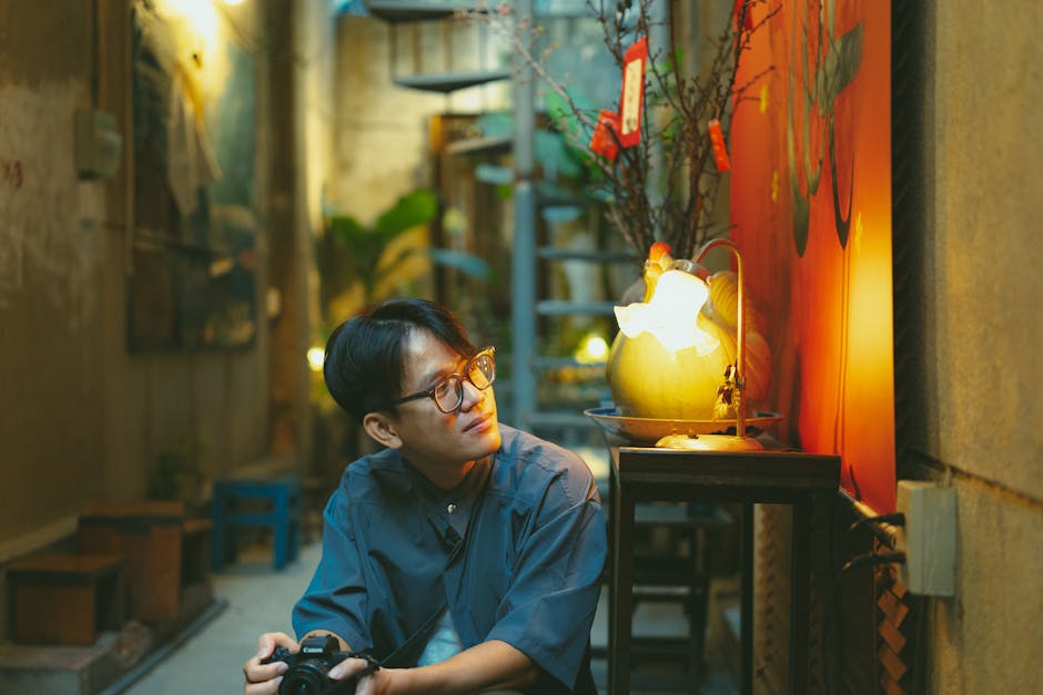 A man with a camera reflects in a vibrant alleyway, Vietnam's Ho Chi Minh City.