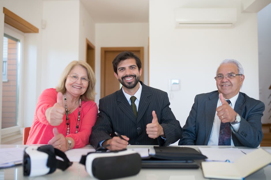 A diverse group in a meeting celebrating a successful agreement with thumbs up.