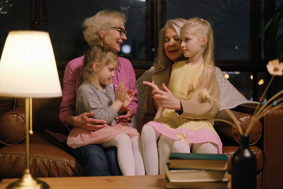 A cozy family gathering with adults and children on a sofa, showcasing warmth and togetherness.