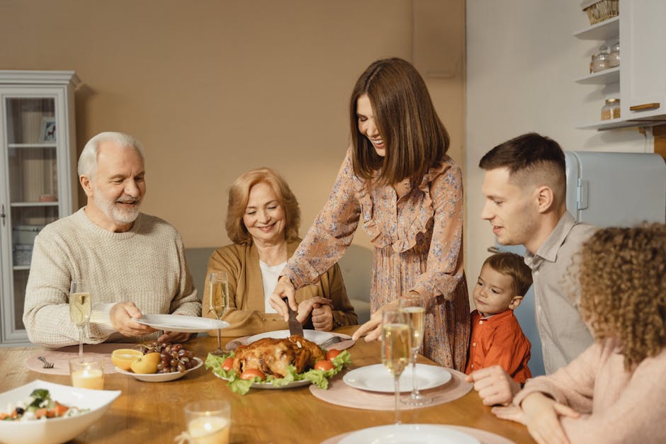 A joyful family gathering around the table for a Thanksgiving dinner with roasted chicken.