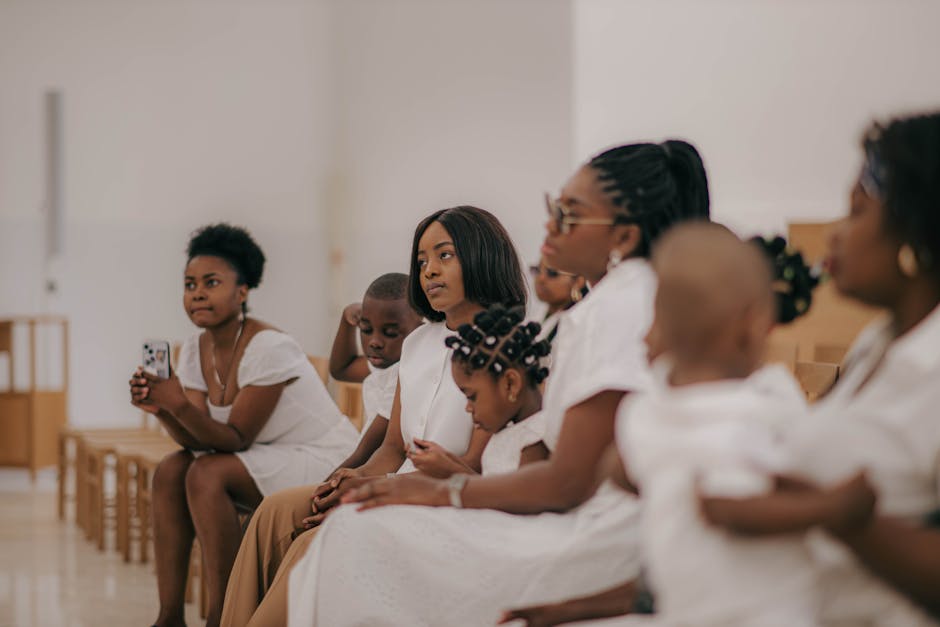 A family gathered indoors, sharing a moment of togetherness in a bright setting.