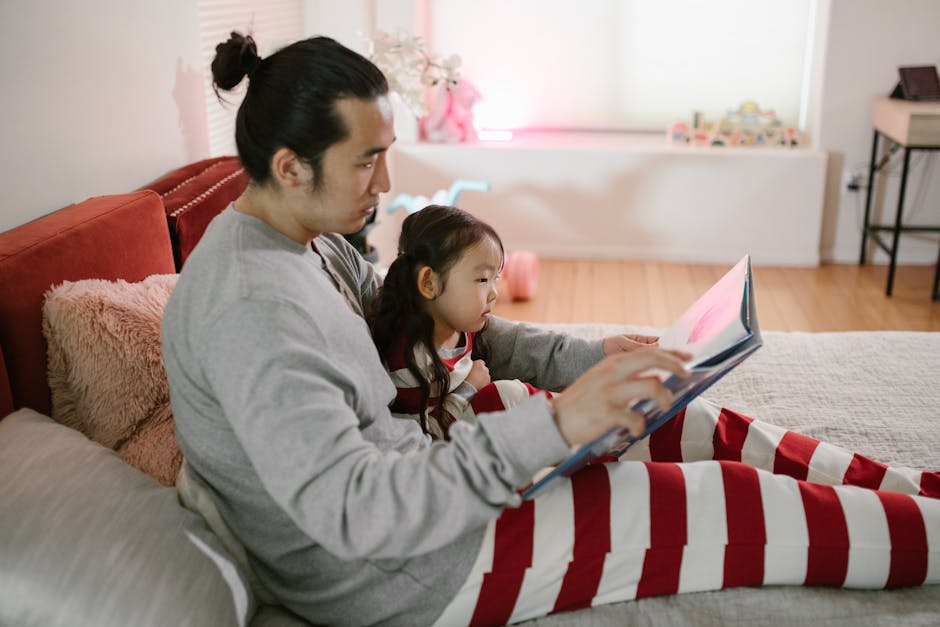 Father and daughter sharing a bedtime story, creating a cozy moment.