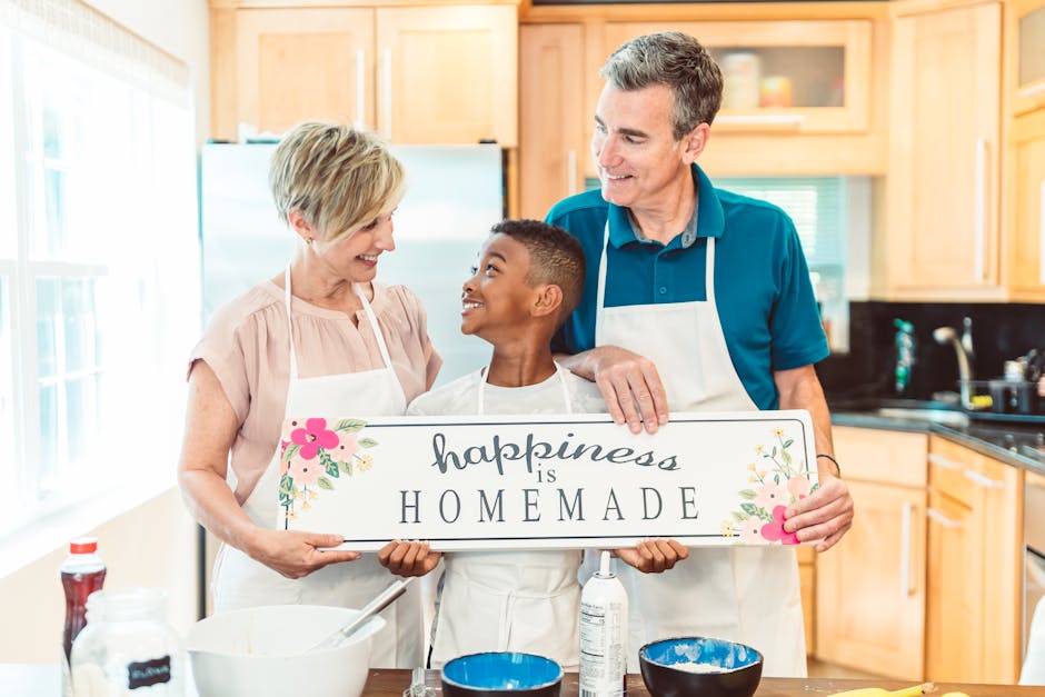A family of three bonding in the kitchen, holding a 'happiness is homemade' sign.