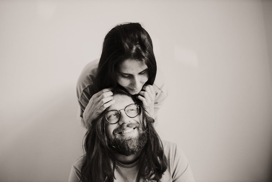A loving couple embracing with joy in a monochrome photoshoot.
