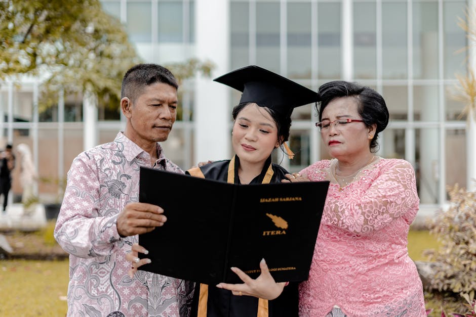 Proud family celebrates daughter's graduation with diploma in hand, captured outdoors.