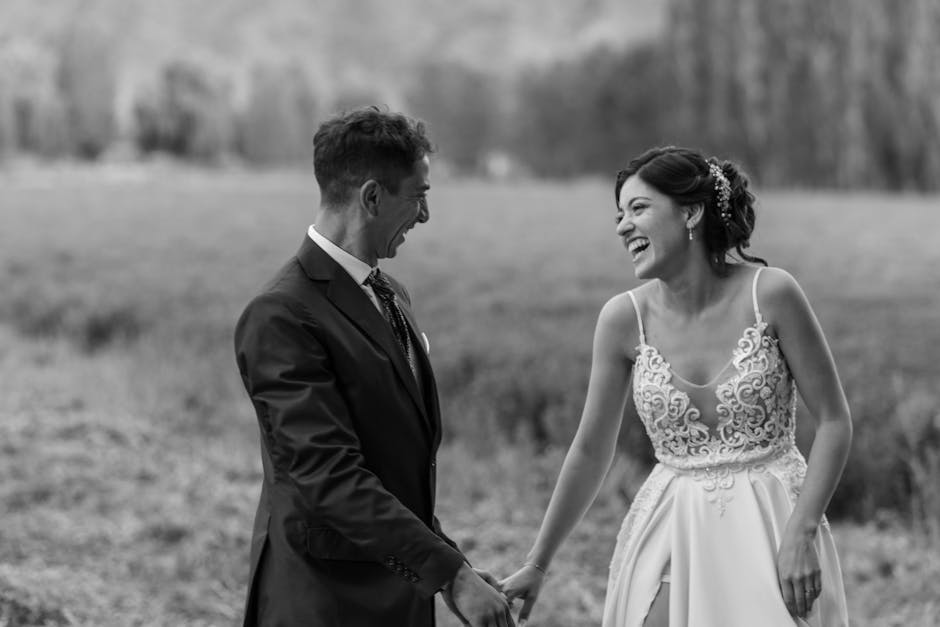 A black and white photo of a couple joyfully sharing a moment on their wedding day in Mendoza.