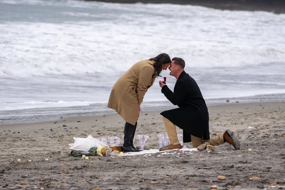 Romantic marriage proposal on a winter beach in Narragansett, Rhode Island.