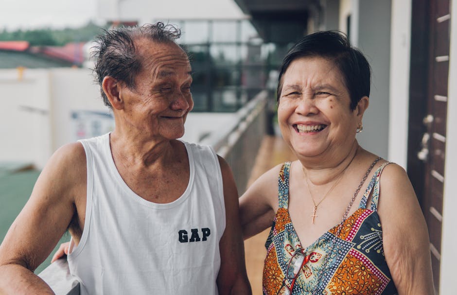 Smiling elderly couple enjoying a moment together outdoors while celebrating life.