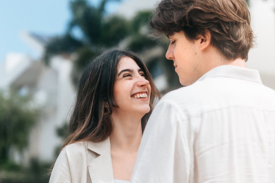 Happy young couple enjoying a sunny day outdoors in Maringá, Brazil.