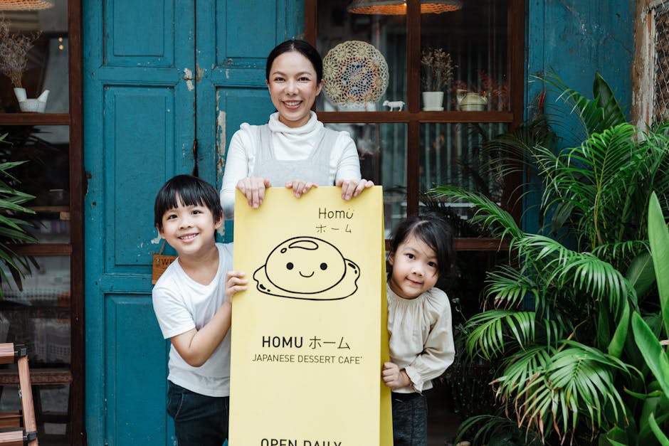 A mother and children smiling happily outside a Japanese dessert café, holding a sign.