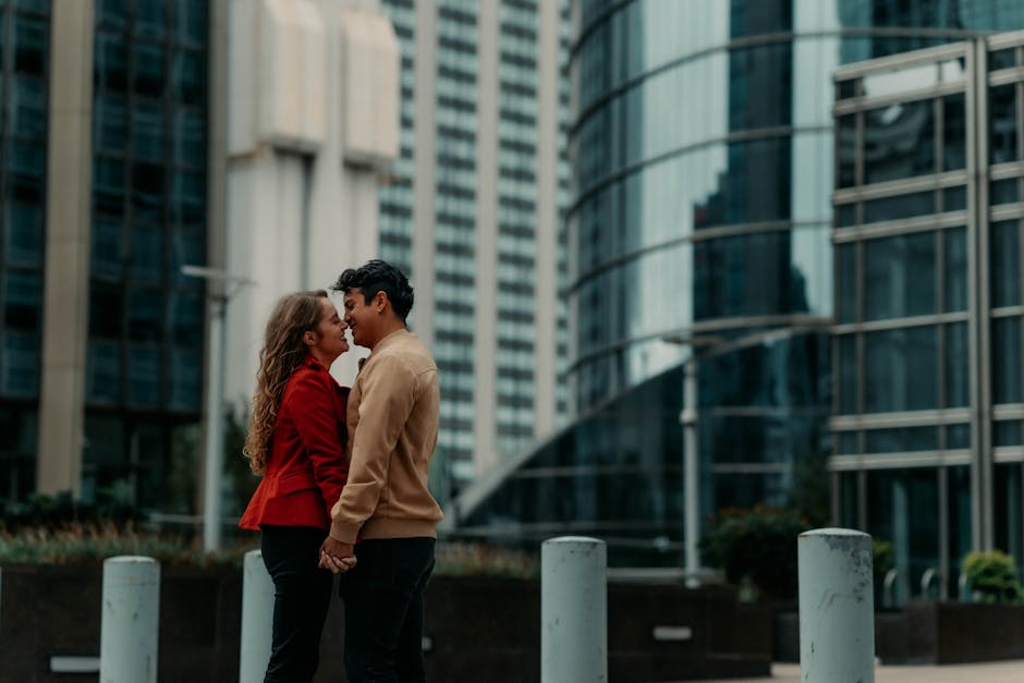 Couple embraces in Buenos Aires cityscape, an urban portrait capturing love and architecture.