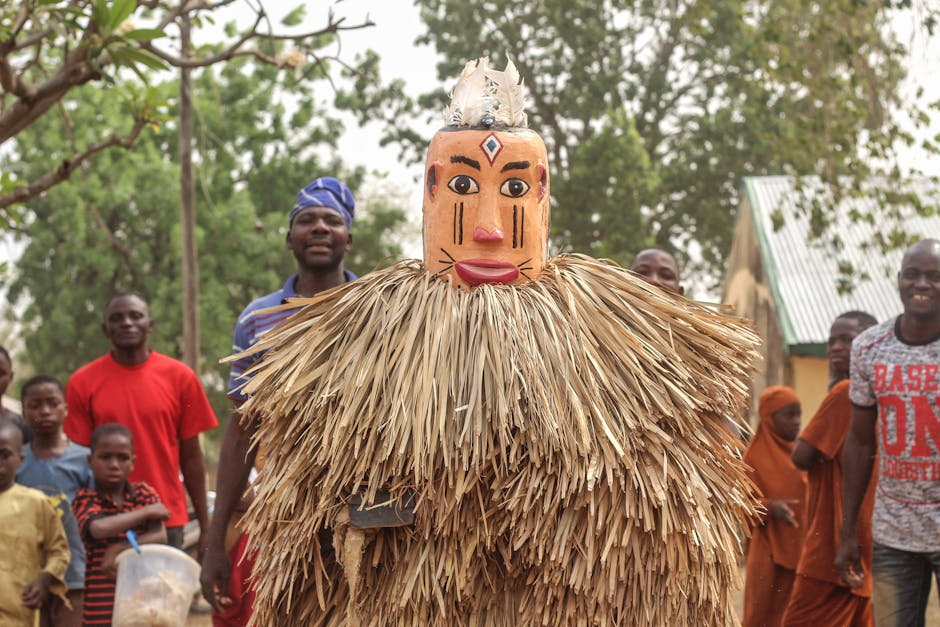 Vibrant African festival with traditional costumes and mask performance, capturing cultural essence.