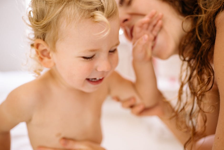 A heartwarming moment of mother and child sharing laughter during playtime indoors.