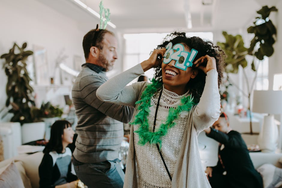 People enjoying a vibrant New Year celebration indoors, filled with laughter and festive decorations.