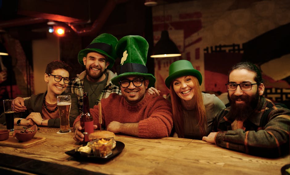 A group of friends celebrating Saint Patrick's Day in a cozy pub, enjoying drinks and laughter.