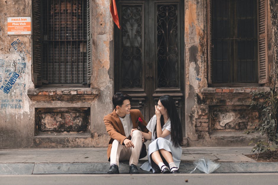 Happy couple laughing and enjoying a moment in an urban setting.