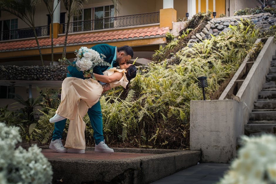 Romantic wedding photo of a couple embracing in a lush garden setting in Santo Domingo, Ecuador.