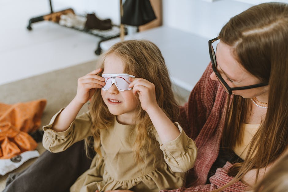 A mother and daughter share a joyful moment indoors, emphasizing love and togetherness.