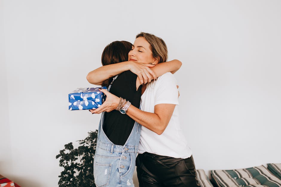 A joyful indoor moment of two family members hugging, showcasing love and togetherness.
