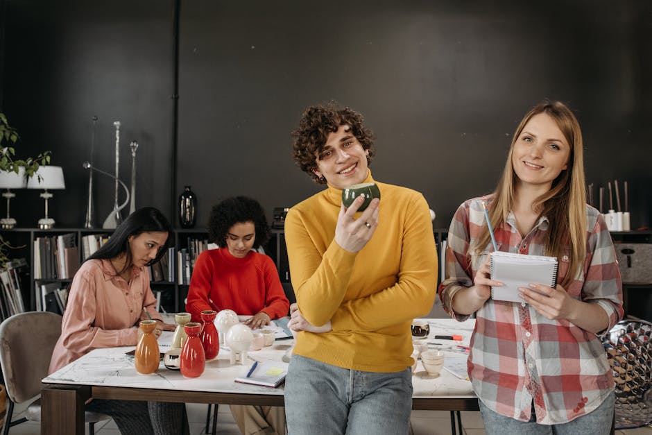 Diverse team working together in a modern office, showcasing creativity, collaboration, and teamwork.