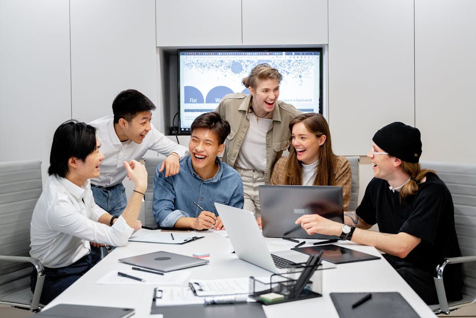 A diverse group of professionals engaging in brainstorming and teamwork in an office environment.