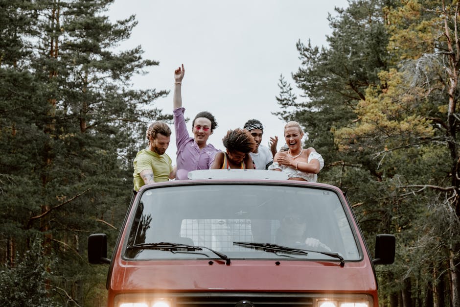 A diverse group of friends having fun on a road trip through a forest.