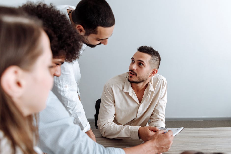 Young team discussing ideas collaboratively in a modern office setting.