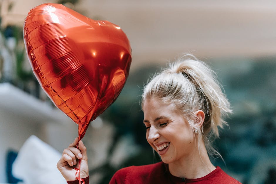 A joyful woman holding a heart-shaped balloon, adding happiness and warmth to the scene.