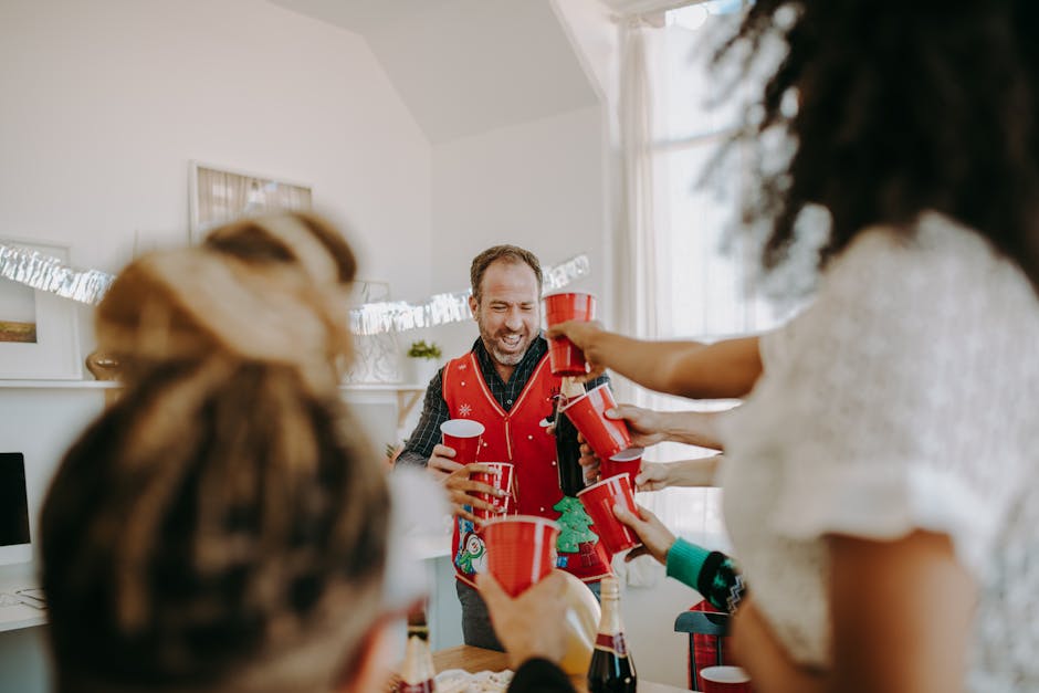 A joyful holiday party with friends toasting indoors, enjoying laughter and cheer.