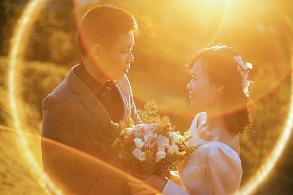 A bride and groom share an intimate moment in a sunlit garden, surrounded by nature.