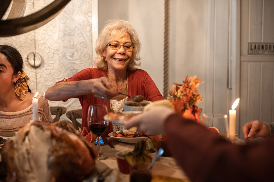 Senior woman enjoying a Thanksgiving dinner, sharing hearty meals with family indoors.