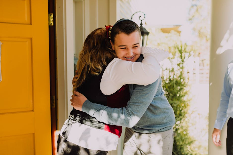 A joyful hug between family members at a holiday gathering, spreading happiness.