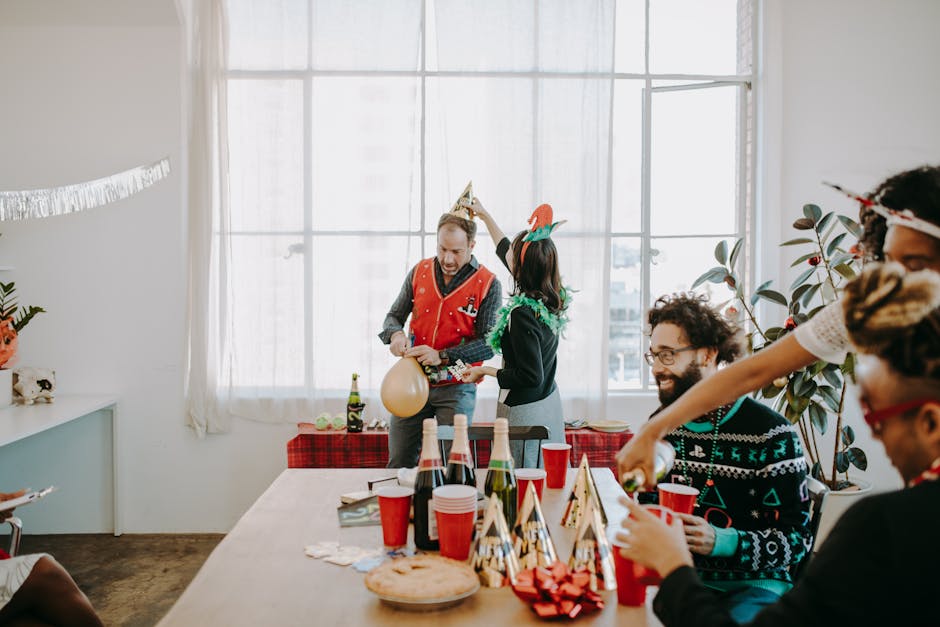 Festive office party with colleagues enjoying holiday cheer and decorations.