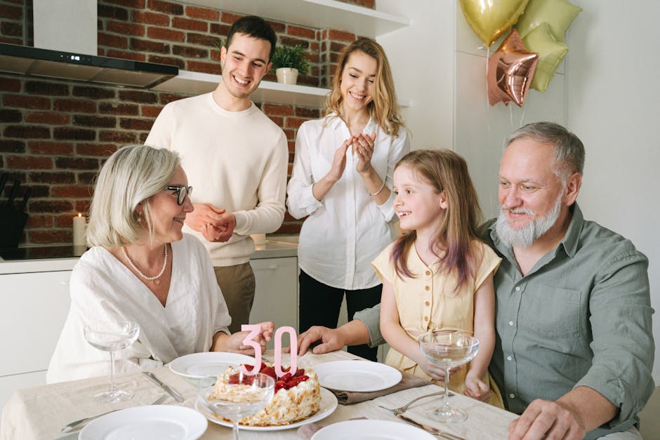 Family with three generations celebrating a 30th anniversary with a cake and balloons indoors.