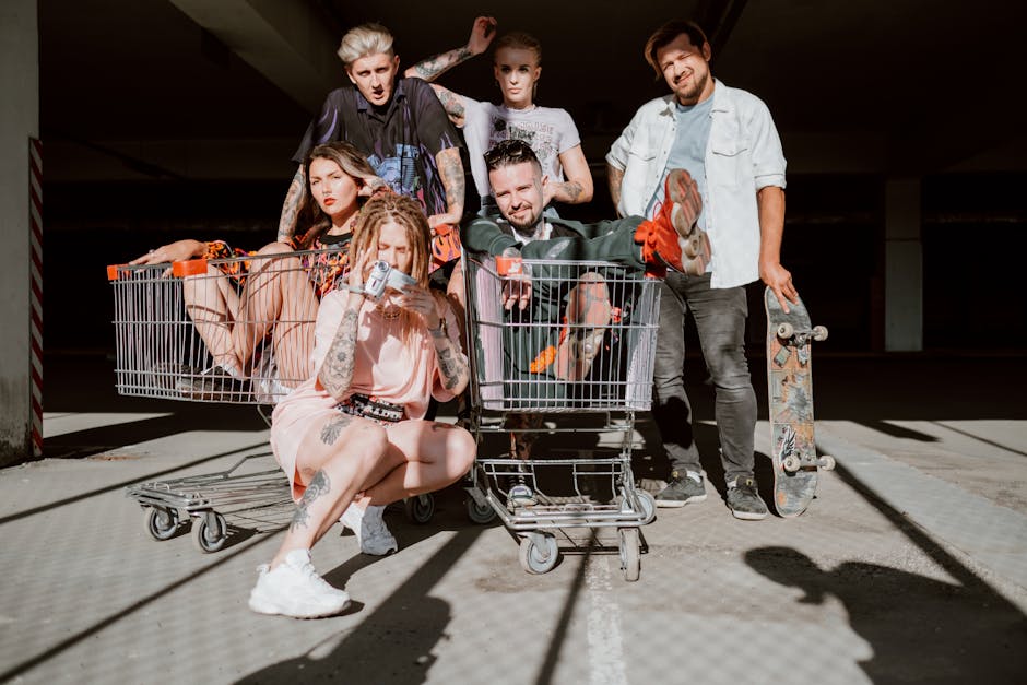 A group of young adults having fun with shopping carts in a parking garage.