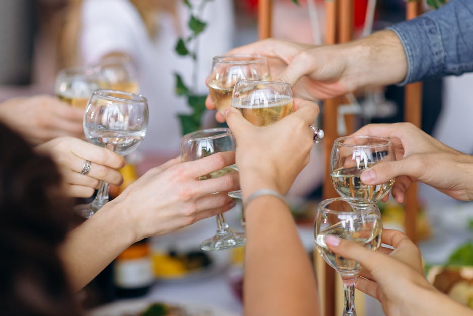 Friendly gathering with people toasting with wine glasses, capturing joyful celebration and togetherness.