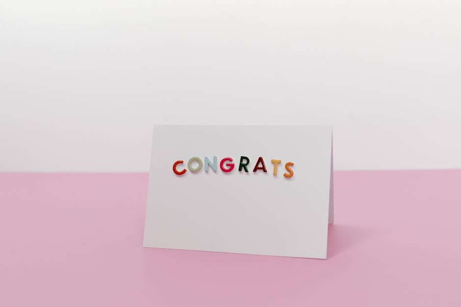Elegant greeting card with colorful 'Congrats' text on pink background, ideal for celebratory occasions.