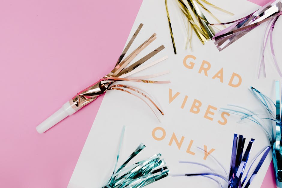 Festive graduation card featuring colorful confetti on a pink background.