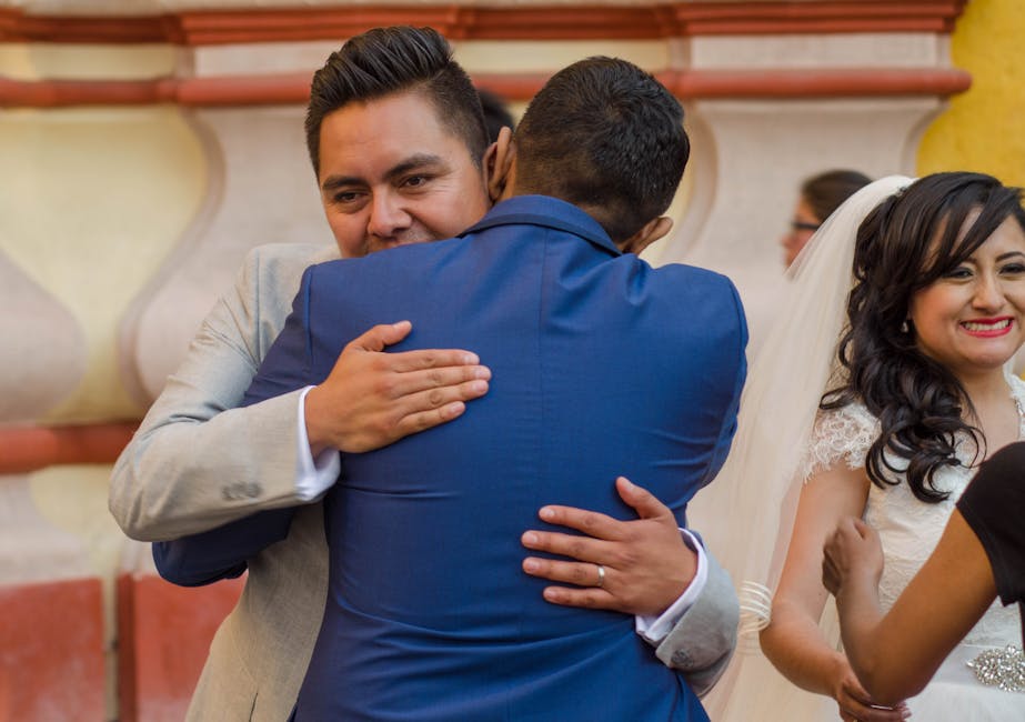 A joyful moment at a wedding in Metepec, Mexico, capturing an affectionate embrace.