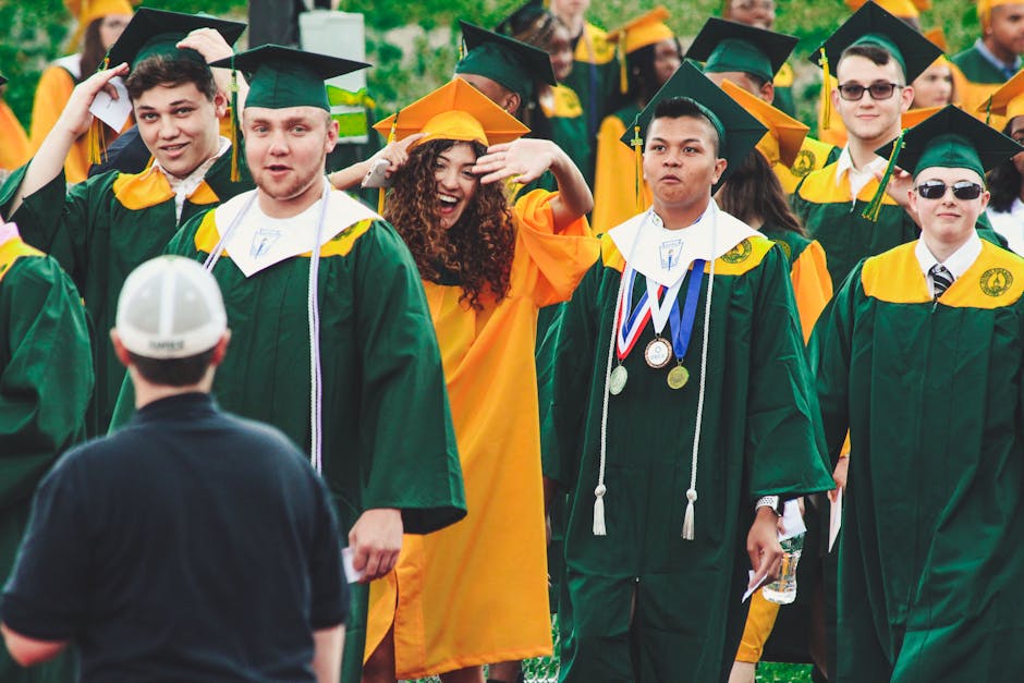 Graduates celebrate with smiles and excitement at an outdoor ceremony in Hamden, CT.