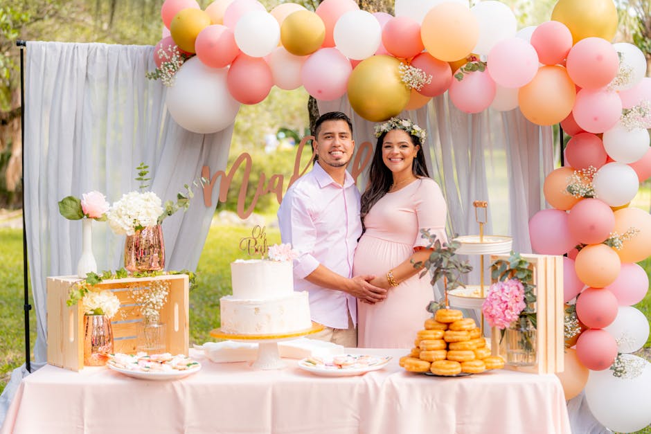 Lovely couple celebrating maternity outdoors with balloons and cake. Perfect for family joy and love themes.