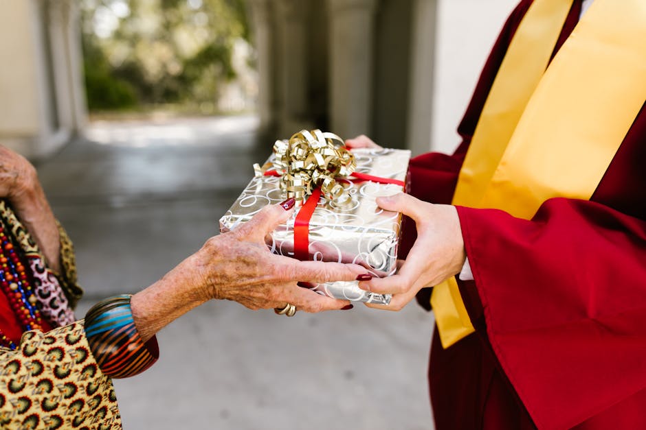 Graduation day gift exchange between a student and an elderly relative, symbolizing success and celebration.