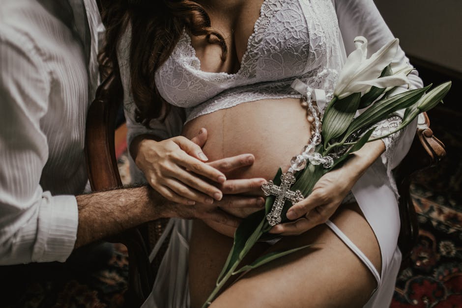 A tender moment shared by a couple embracing maternity, highlighting love and anticipation.
