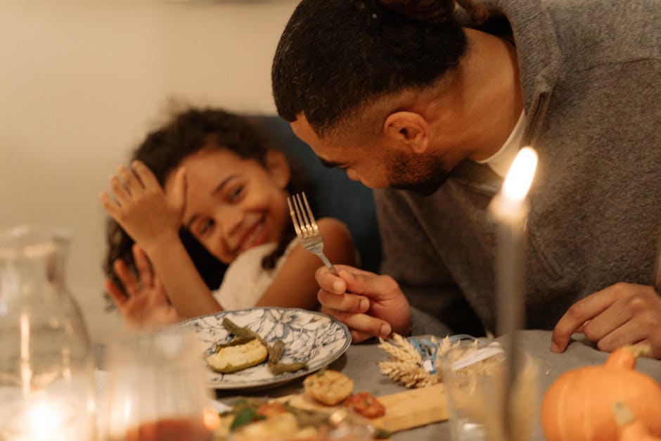Joyful family dinner with candlelights and smiles, capturing warmth and togetherness.